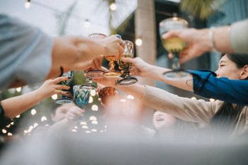 a group of people sitting at a table with drinks